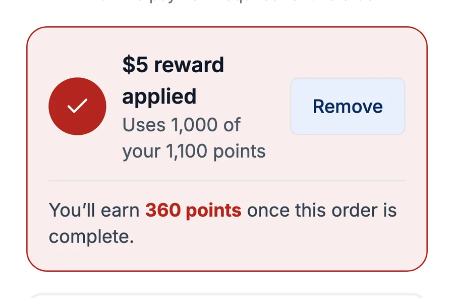 Checkout with the $5 reward applied, using 1,000 of the customer's 1,100 points